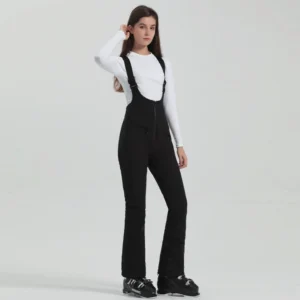 Women's black slim flared bib ski overalls with front zipper, adjustable suspenders, black ankle cuffs, and ski boot styling