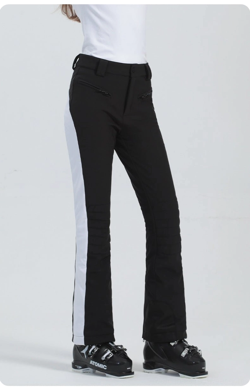 Black women's technical streetwear ski pants with white side stripe, clean flared cuff, and athletic silhouette