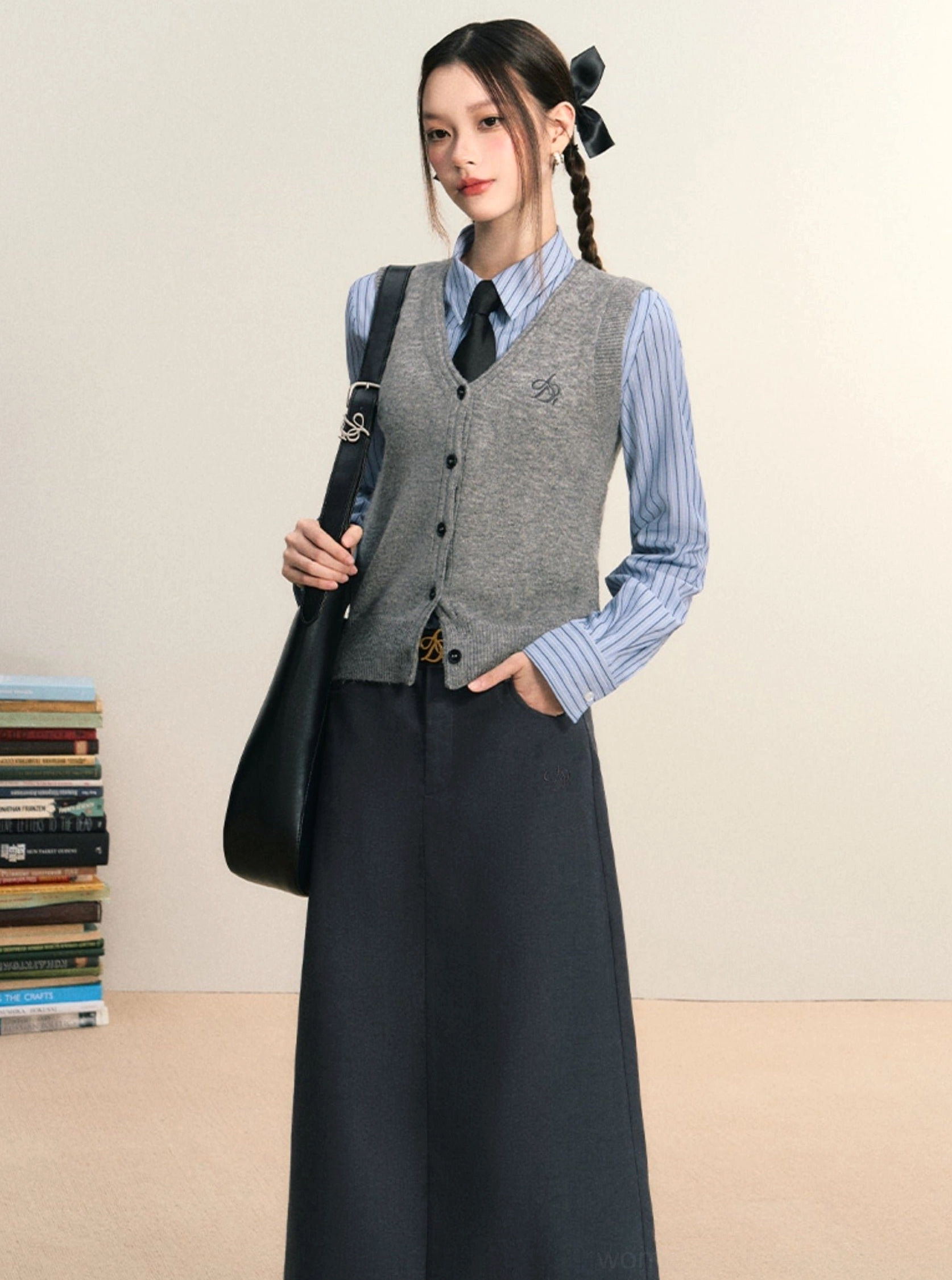 Blue striped women's Korean preppy shirt layered with grey button knit vest and dark long skirt