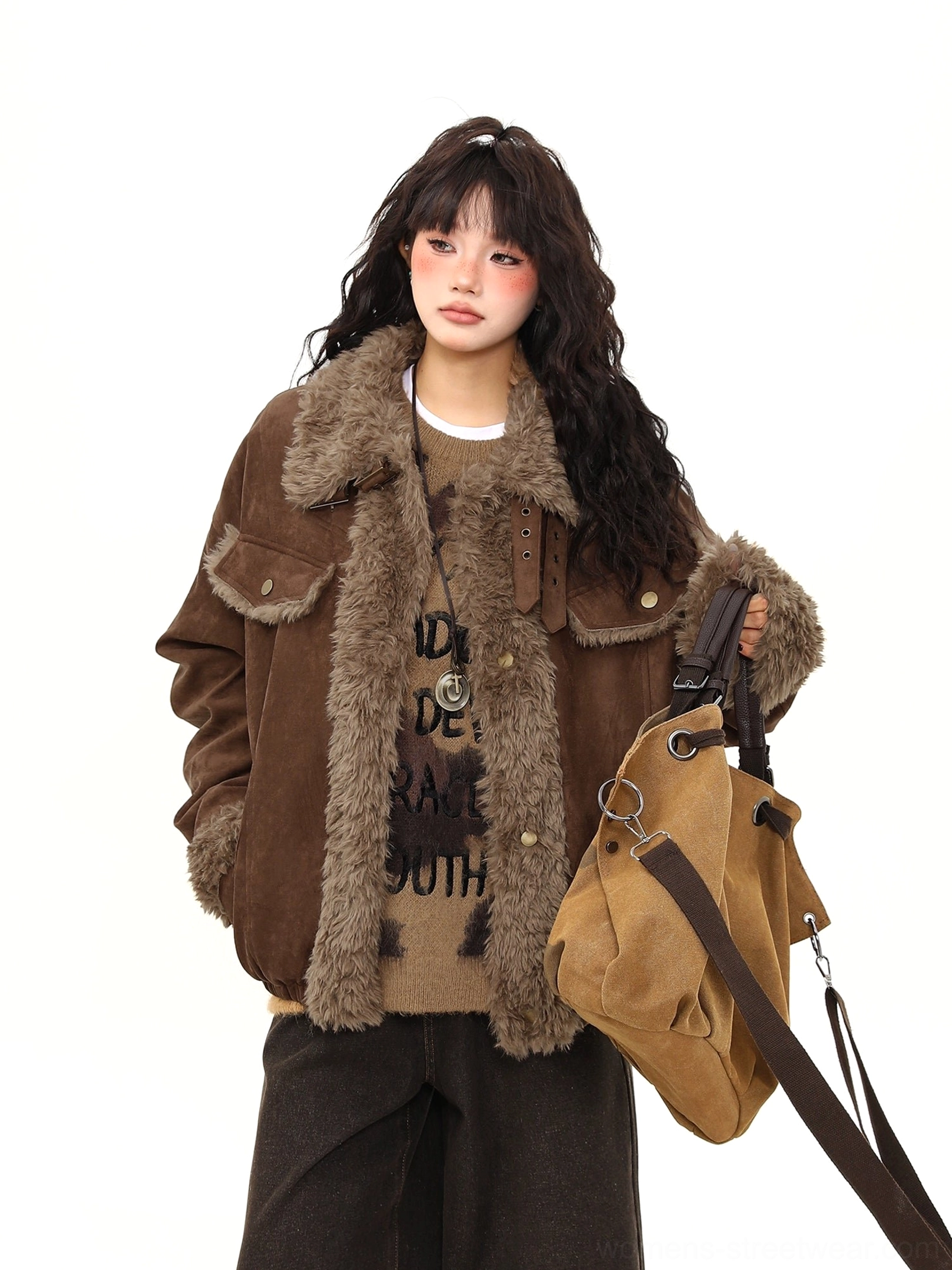 Front view of a women’s brown shearling lined aviator jacket with oversized fit, faux-fur collar, chest pockets, and winter streetwear styling
