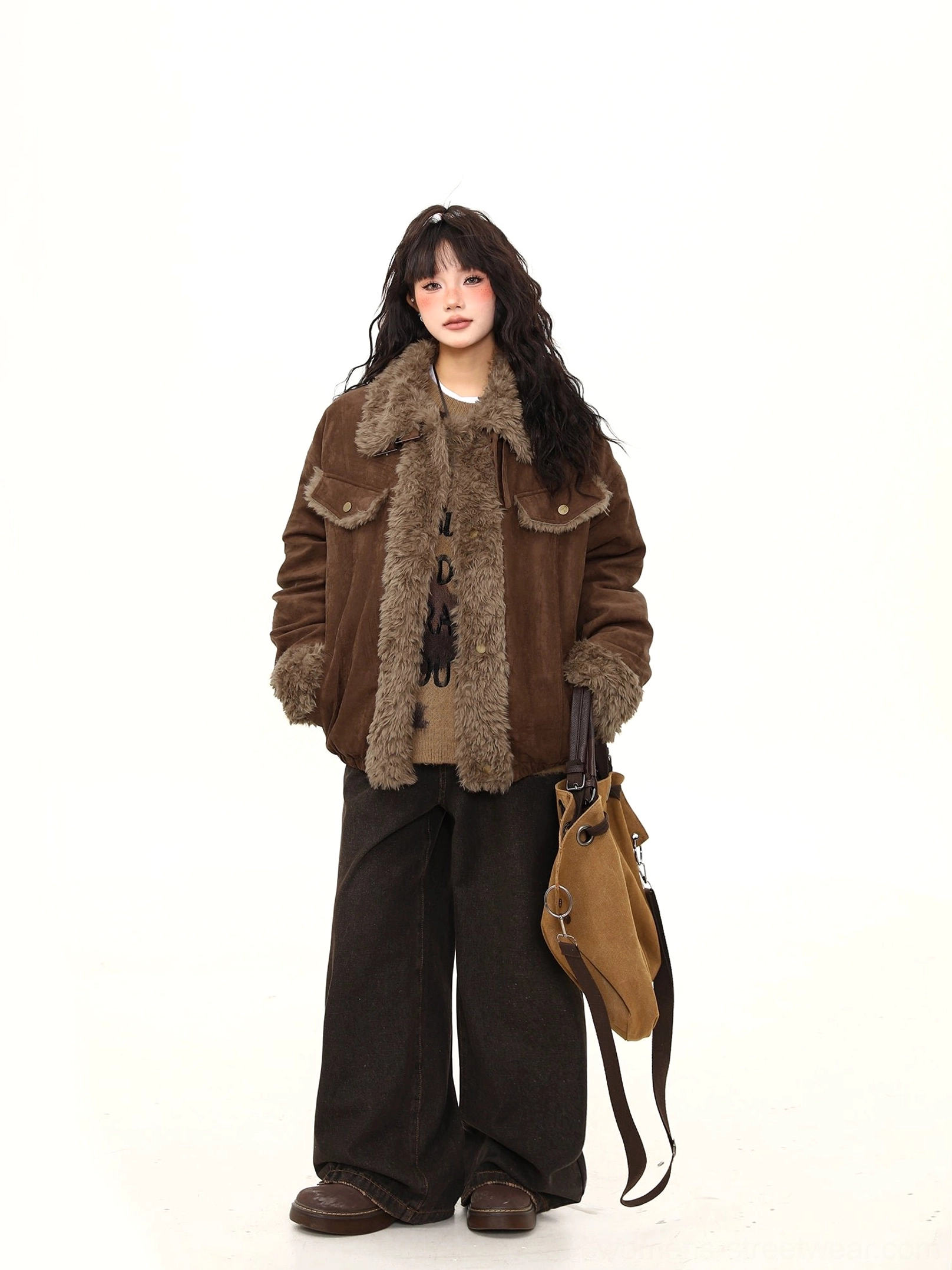 Side view of a women’s oversized brown aviator jacket with thick faux-shearling trim and relaxed winter streetwear fit
