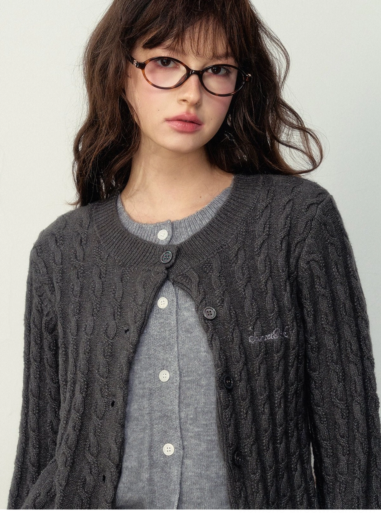 Women's cable knit preppy cardigan with textured knit pattern and button front for Korean streetwear styling