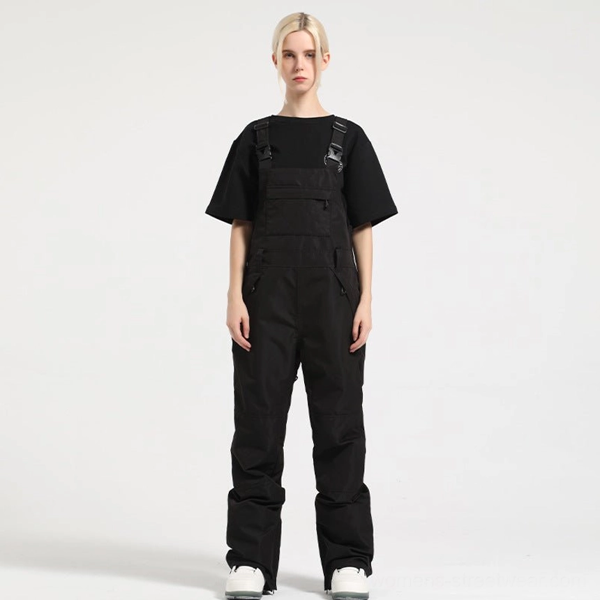 Black women's bib snow pants with hidden front zipper closure, utility pockets, and straight-leg winter fit