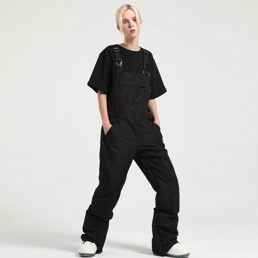 Black women's bib snow pants with matte technical fabric, functional pockets, and relaxed straight-leg fit