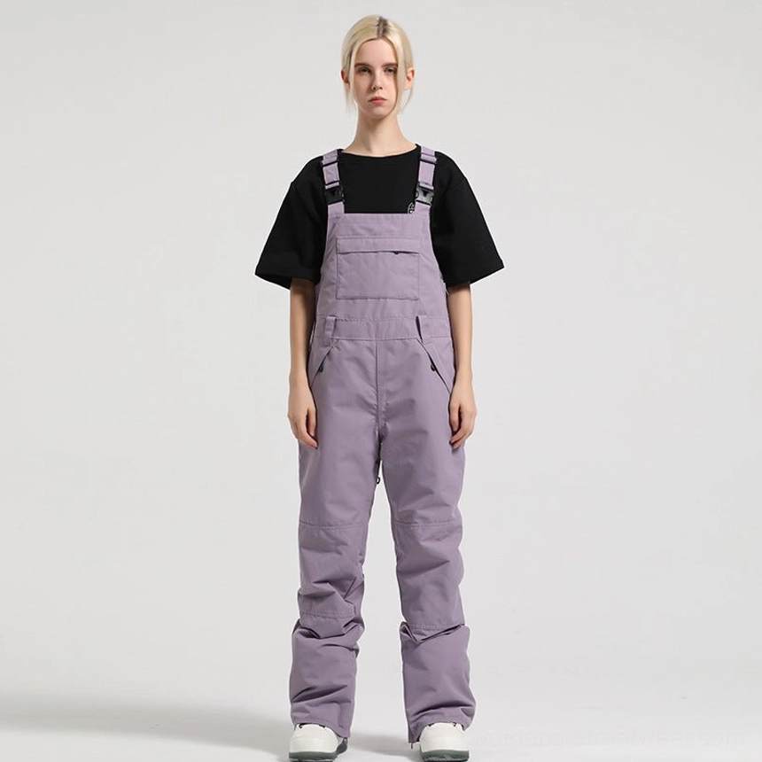 Dusty lavender women's bib snow pants with adjustable shoulder straps and soft muted winter color