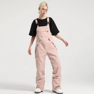 Pink women's colorblock bib snow pants with relaxed straight legs, front utility pockets, and winter streetwear styling