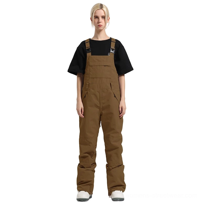 Women's waterproof windproof bib snow pants with relaxed legs, reinforced lower legs, and technical winter protection