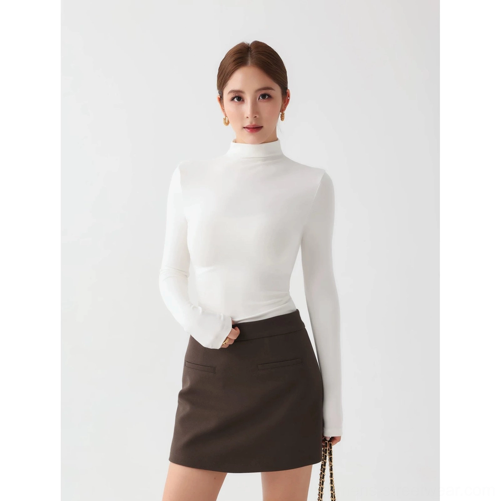 Women's contemporary mock neck stretch top with long sleeves and clean minimalist streetwear design