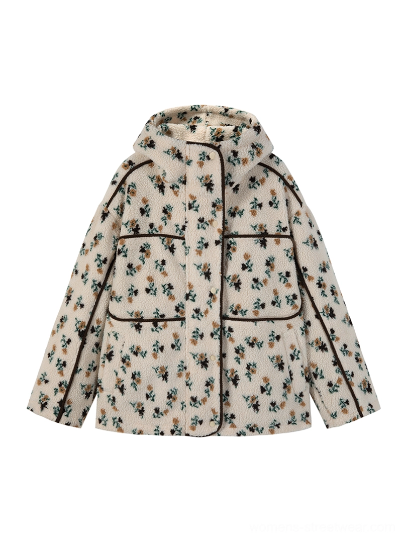 Women's cream floral print sherpa hooded jacket with front zip closure, black contrast piping, and side pockets flat lay
