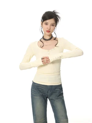 Women's cream yellow ribbed button V-neck Henley long sleeve slim fit top with wide-leg jeans