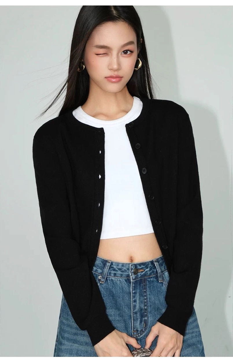 Women's cropped crew neck button front knit cardigan with ribbed hem and long sleeves