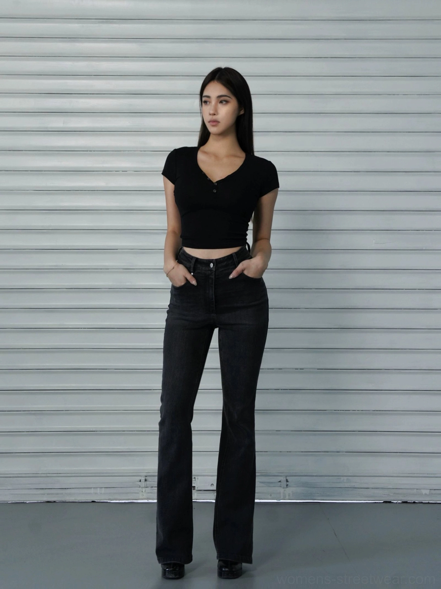 Black women's cropped Henley T-shirt with contrast button placket styled with dark wash flared jeans