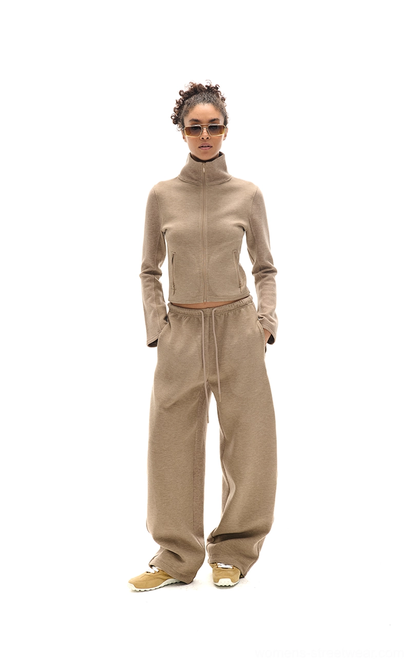 Women's cropped zip-up sweatshirt and matching high-waisted sweatpants two-piece streetwear outfit
