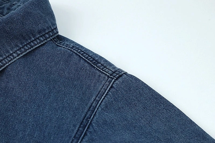 Women's dark blue denim overshirt jacket with medium thickness, classic shirt styling, and comfortable loose fit