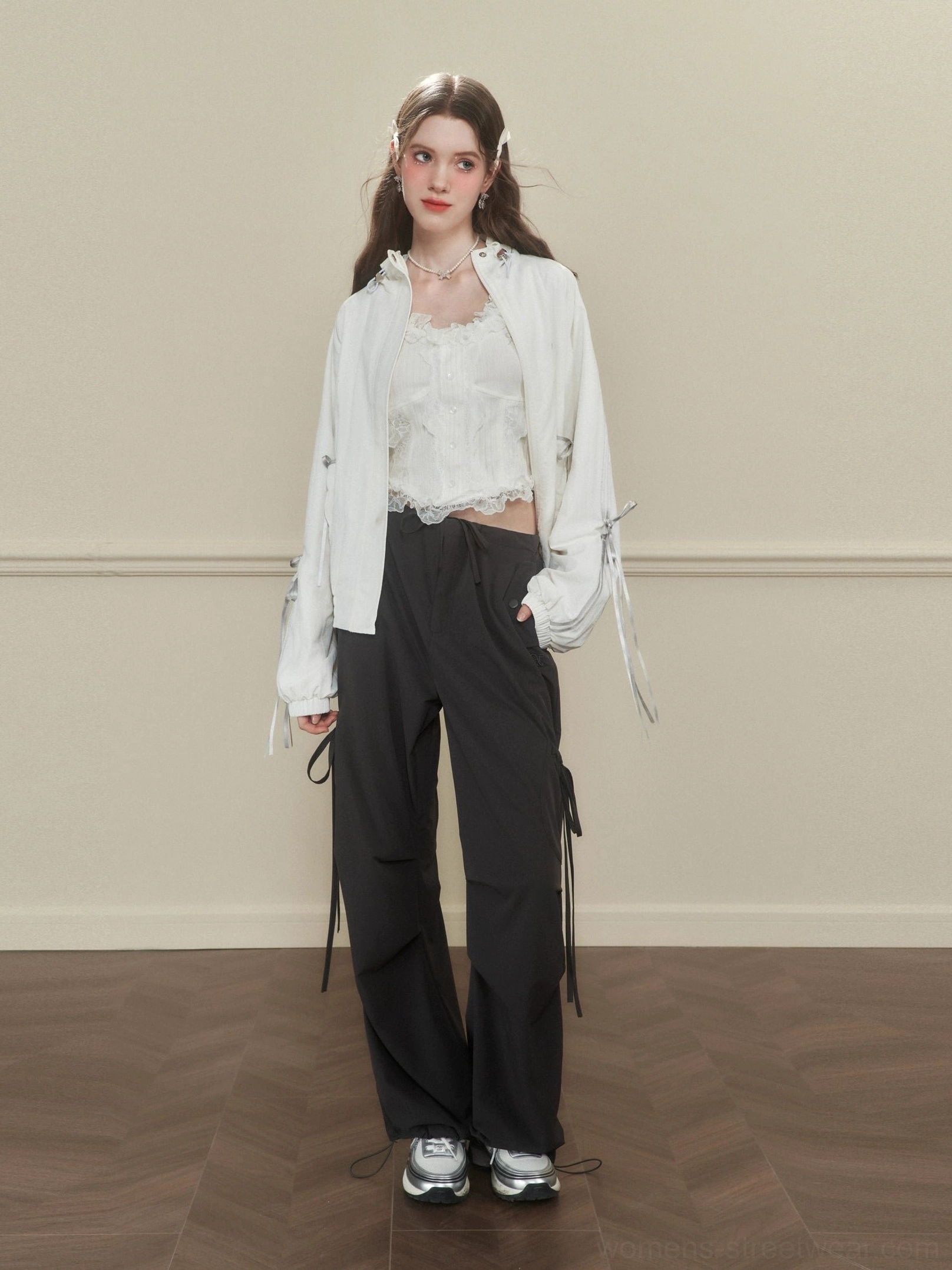 Women's dark gray Korean streetwear wide-leg cargo pants with side tie details styled with a lace top and coat