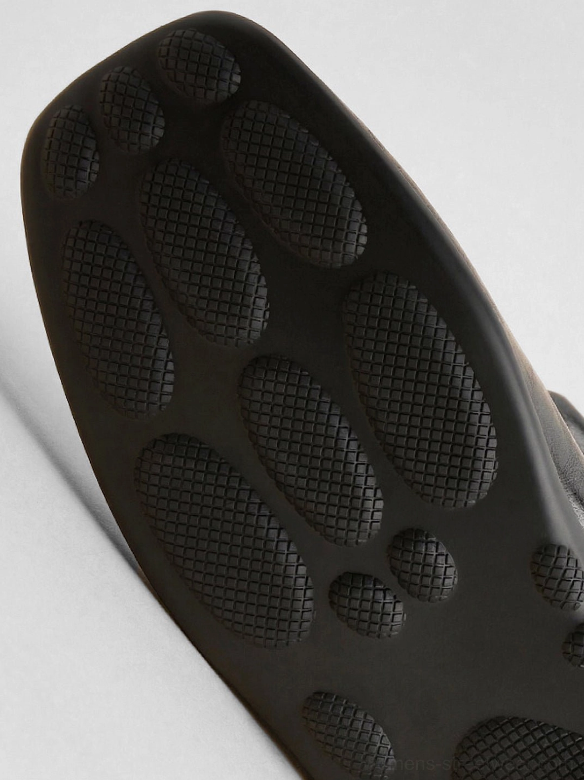 Women's detachable bow cutout square-toe utility boots close-up showing the sculptural streetwear boot silhouette
