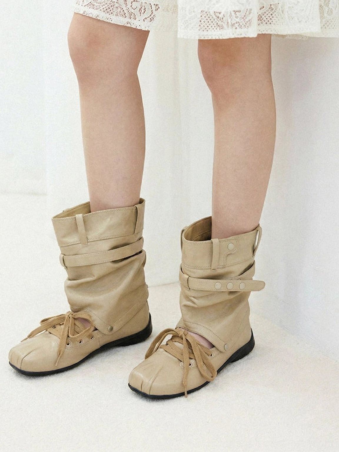 Women's detachable bow cutout square-toe utility boots showing mid-calf cutout sandal boot construction