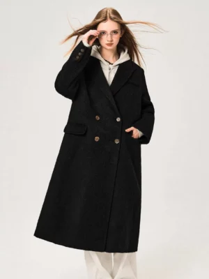 Black women's double-breasted Merino wool midi overcoat with relaxed tailored silhouette three-quarter front view