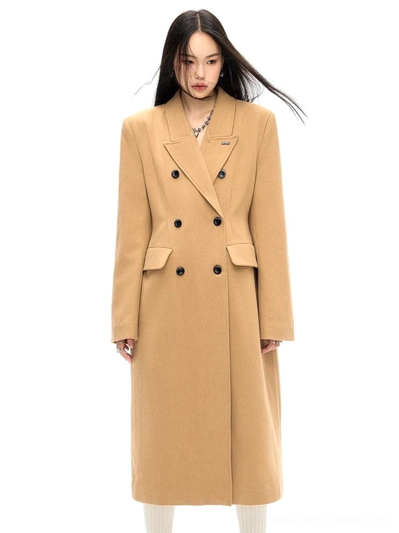 Womens double-breasted wool coat with flap pockets and refined structured tailoring