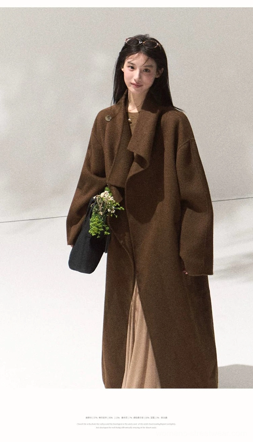 Women's camel brown draped lapel wool overcoat with loose sleeves and minimalist tailored longline design