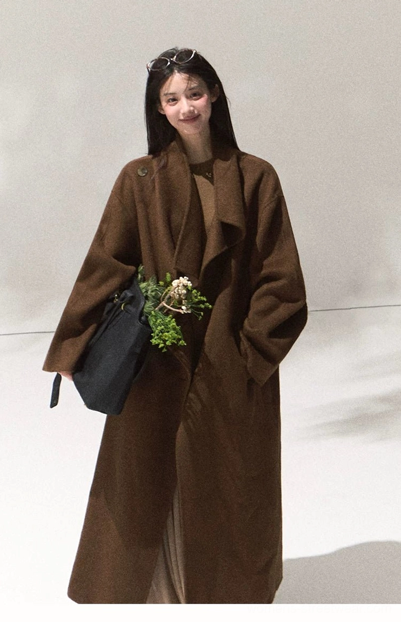 Women's camel wool longline overcoat in Seoul minimalist style with oversized fit and functional side pocket