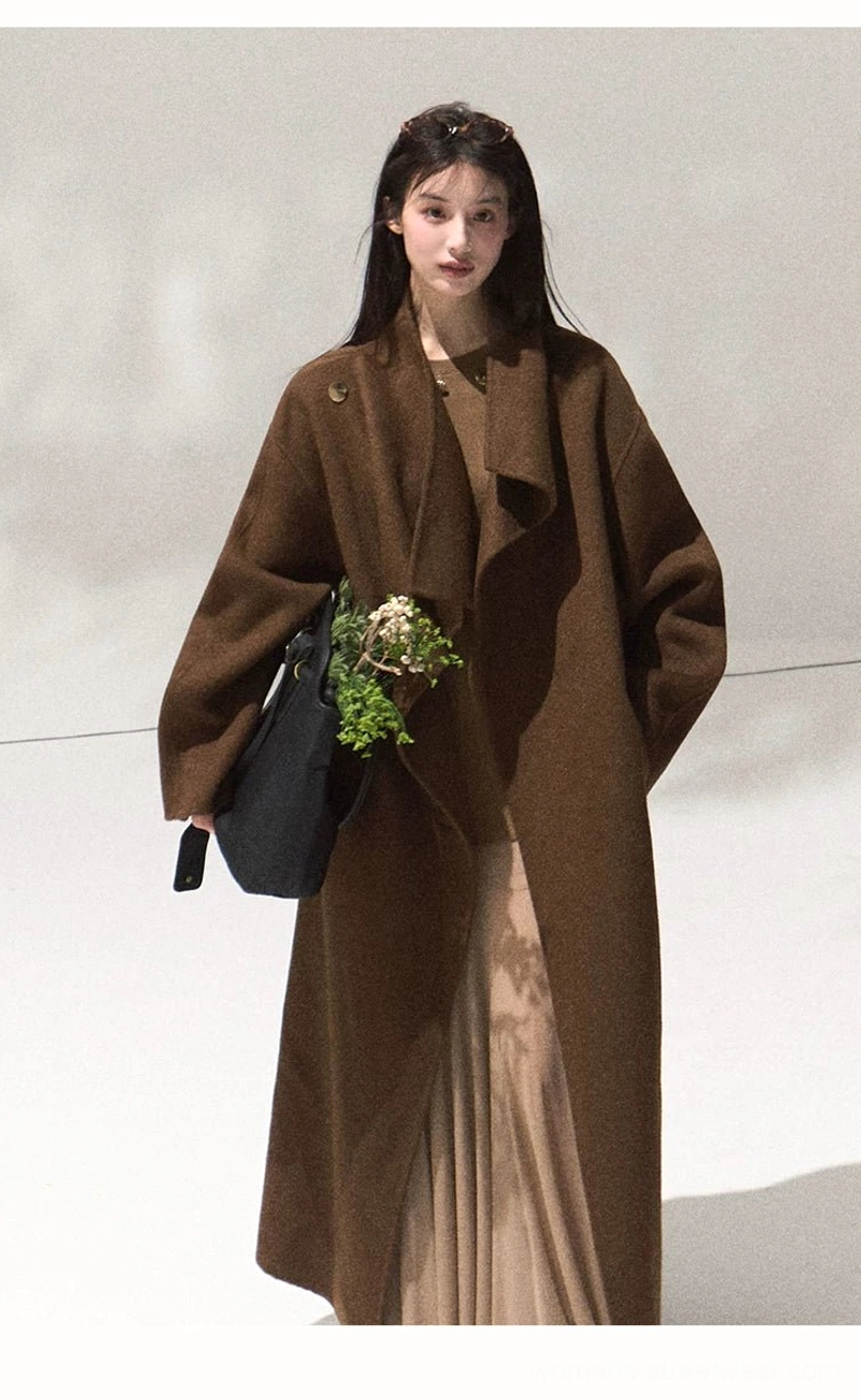 Three quarter front view of women's camel draped wool longline overcoat with relaxed fit and side pocket