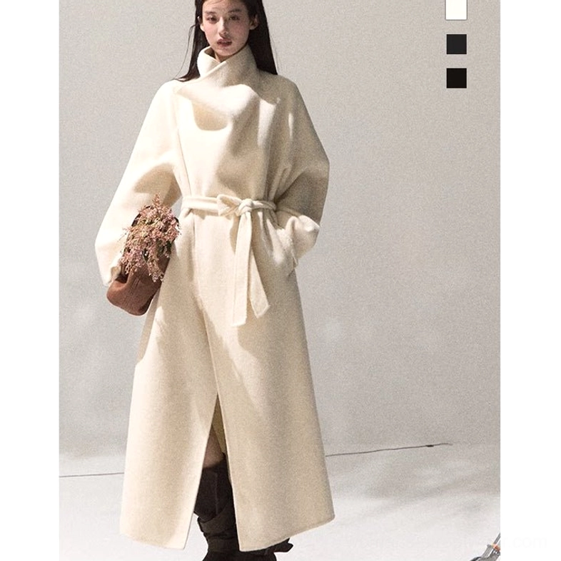 Women's white long draped wool overcoat with oversized relaxed fit and elegant minimalist lapel
