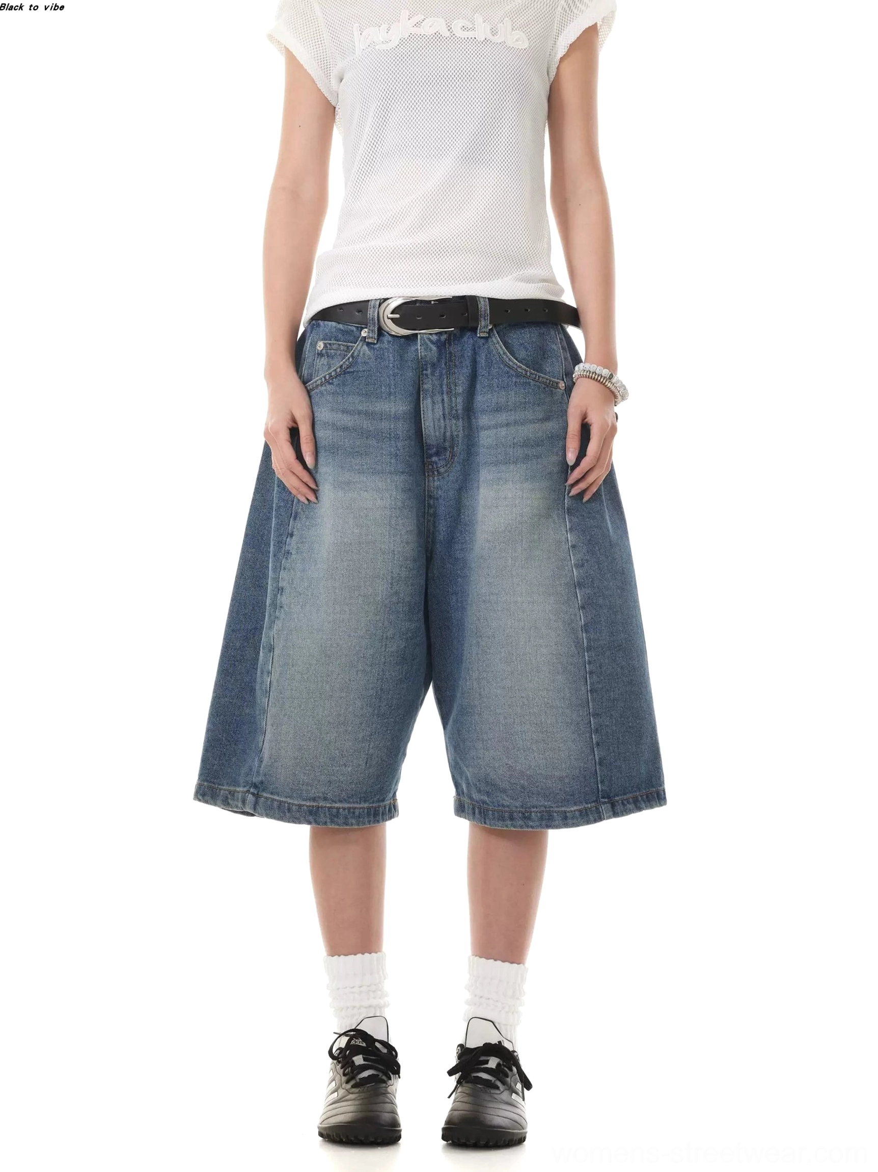 Front view of relaxed women's denim Bermuda shorts featuring a faded blue wash, straight wide-leg cut, classic waistband, and retro streetwear styling