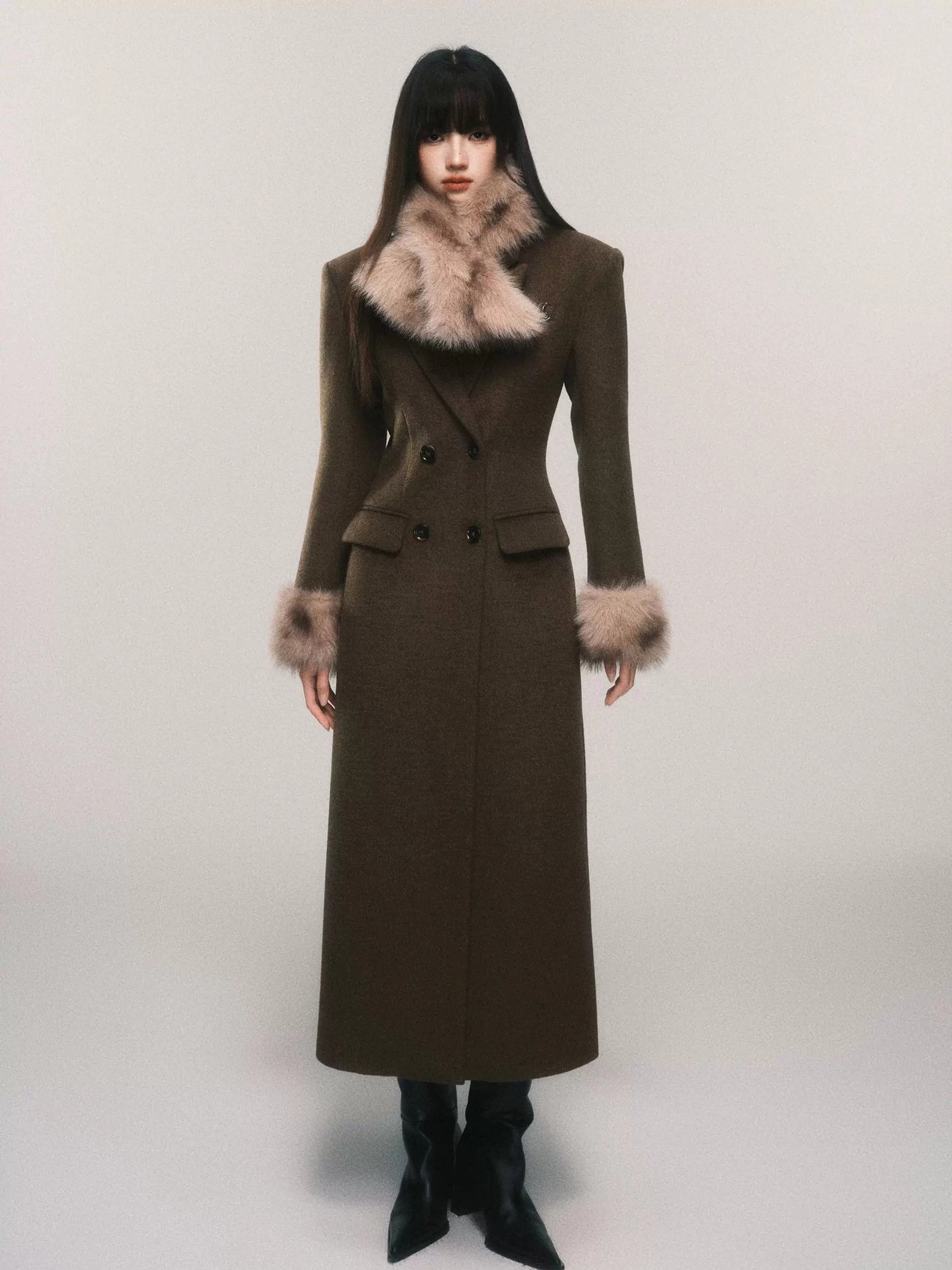 Women's long faux fur cuff wool blend maxi coat styled in a full front studio view with tailored double-breasted silhouette and matching fur scarf
