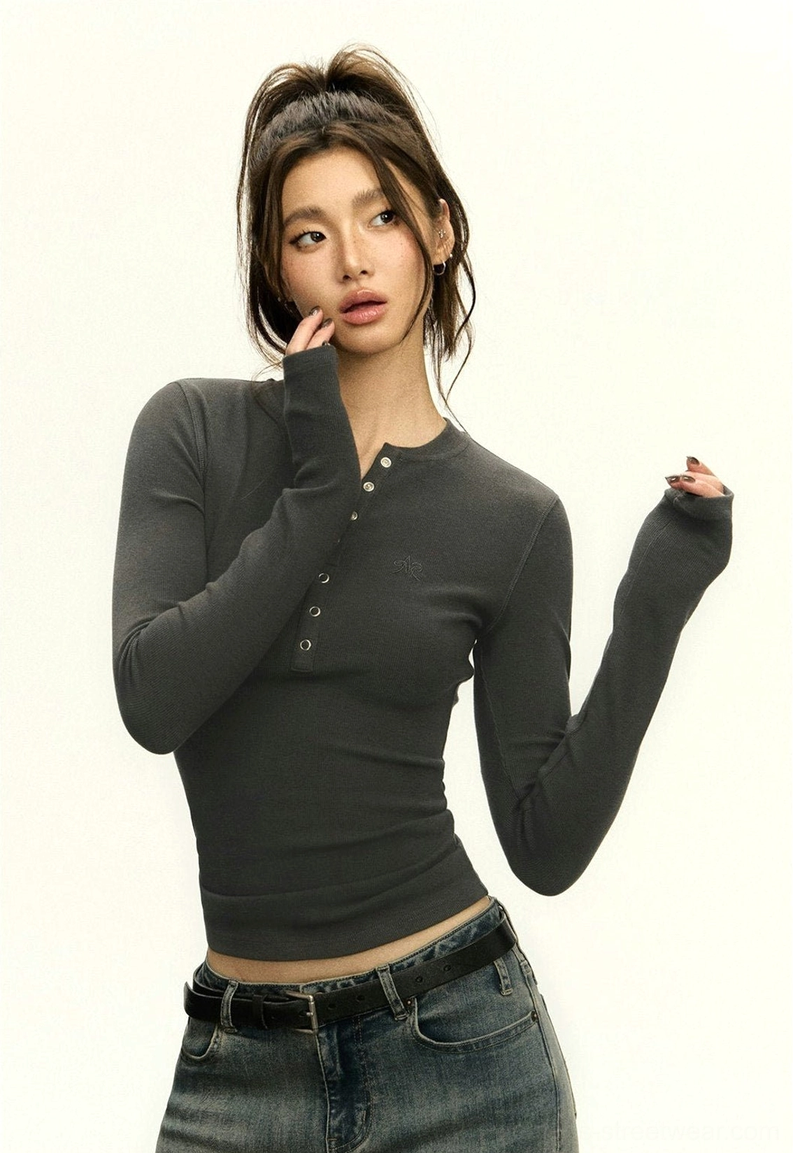 Women's fitted Henley crop top with subtle ribbed texture, half-button placket, and versatile casual styling