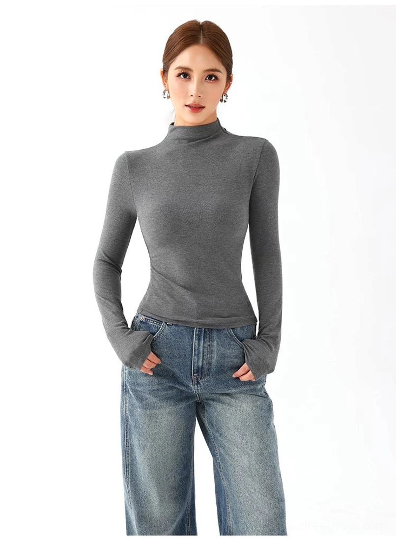 Women's fitted mock neck long sleeve top in contemporary Korean streetwear inspired minimalist styling