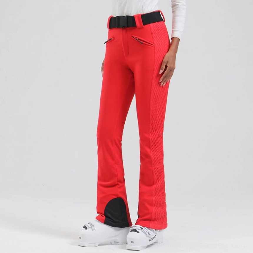 Women's flared quilted side-panel ski pants with waterproof stretch fabric, adjustable belt, boot-friendly cuffs, and streetwear styling