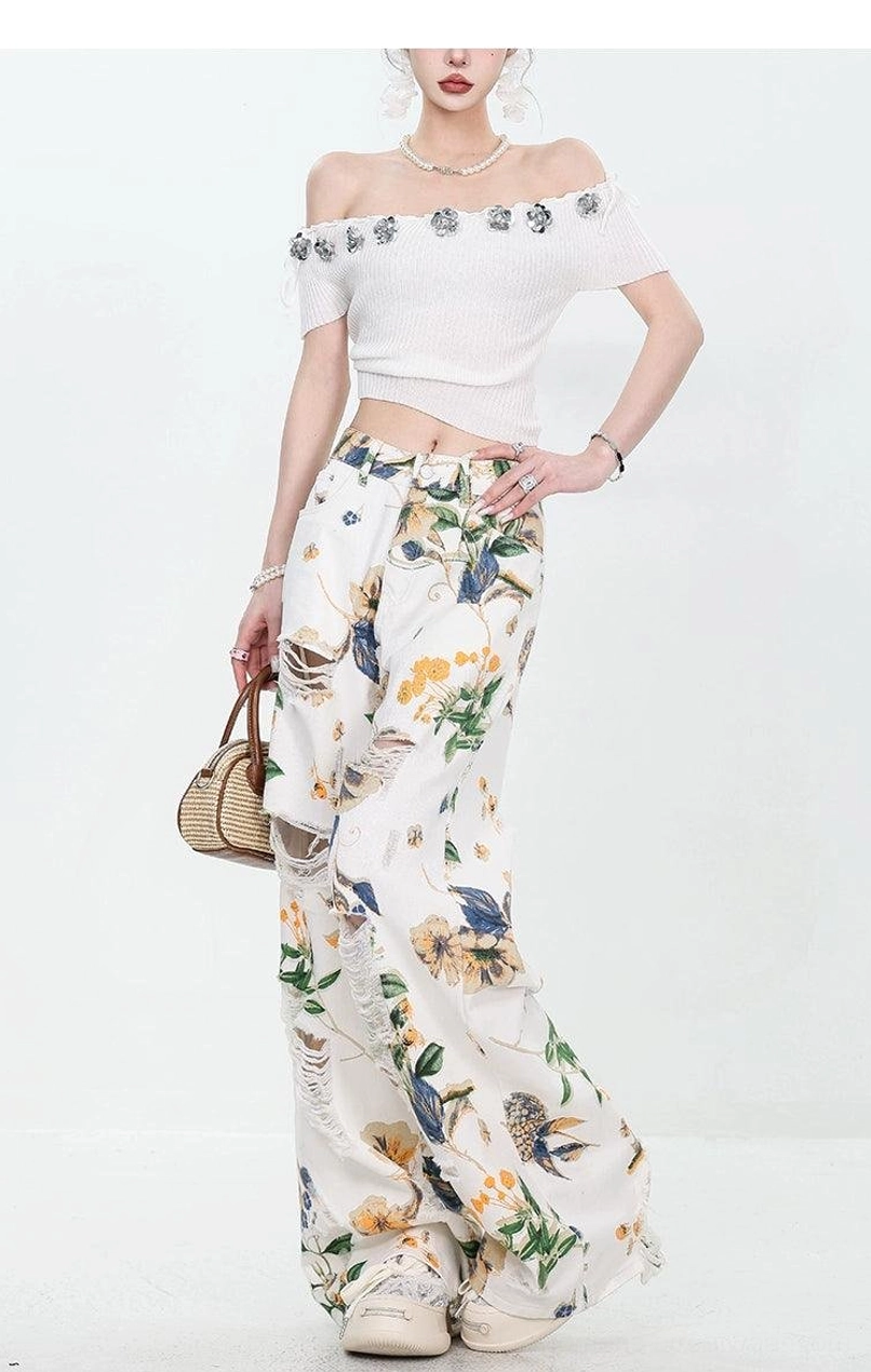 Women's floral distressed wide-leg streetwear jeans product view with relaxed high-waisted silhouette