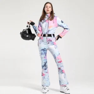 Women's flower print belted flared one-piece ski jumpsuit front view with hood and white ski boots