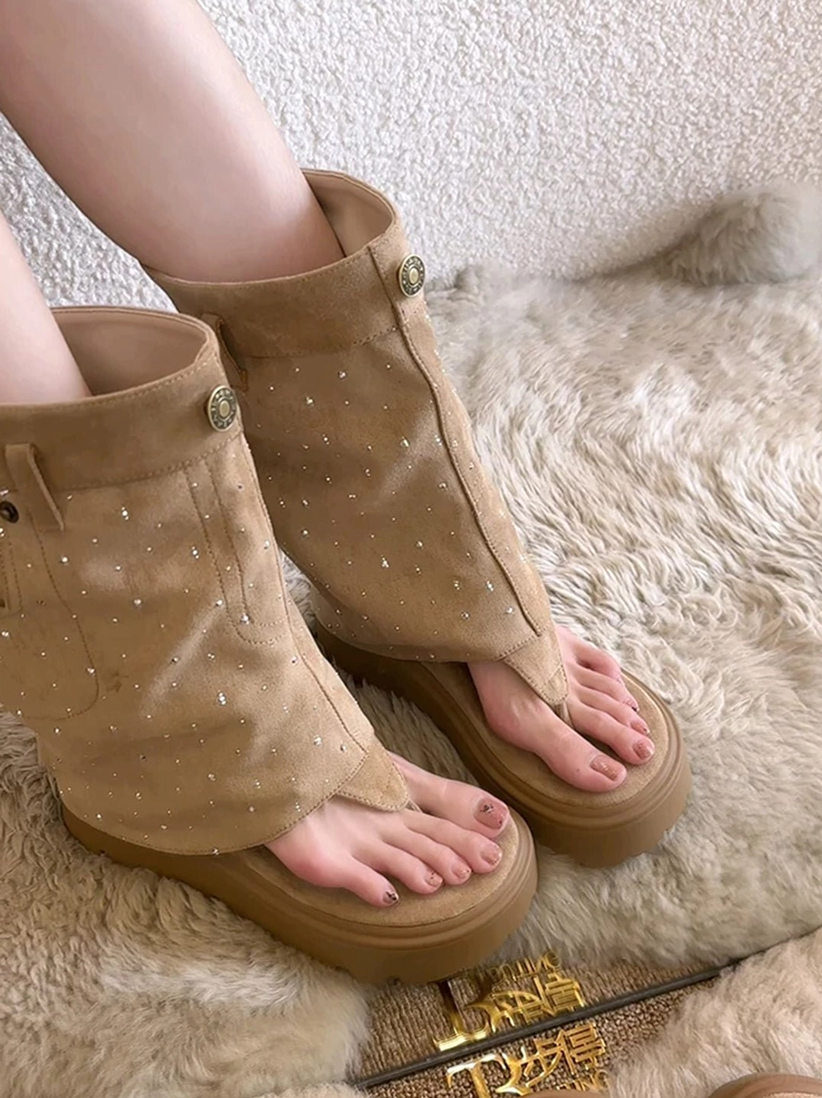 Side view of khaki fold-over Roman sandal boots with open thong toe and deep ridged platform sole