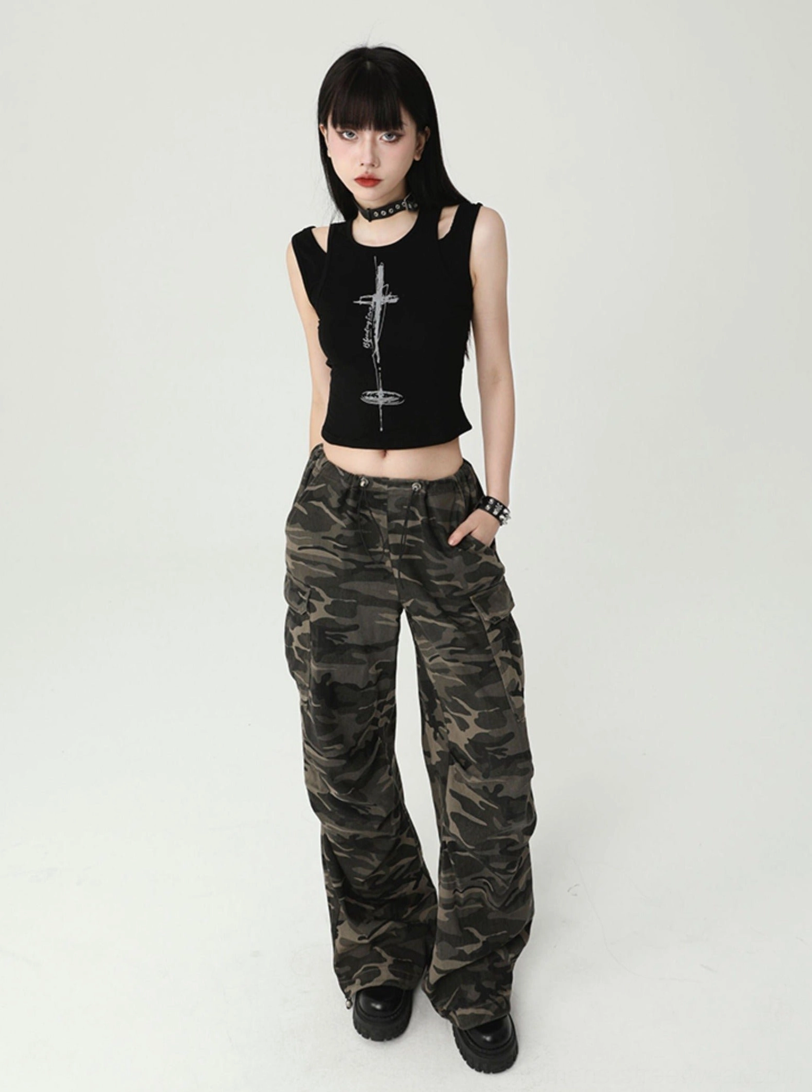 Women's gothic cross cutout cropped tank top styled as a black streetwear outfit with a fitted silhouette and edgy alternative fashion details