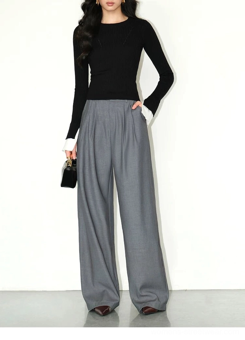 Women's high-waist wide-leg tailored trousers with relaxed streetwear proportions and smooth suiting fabric