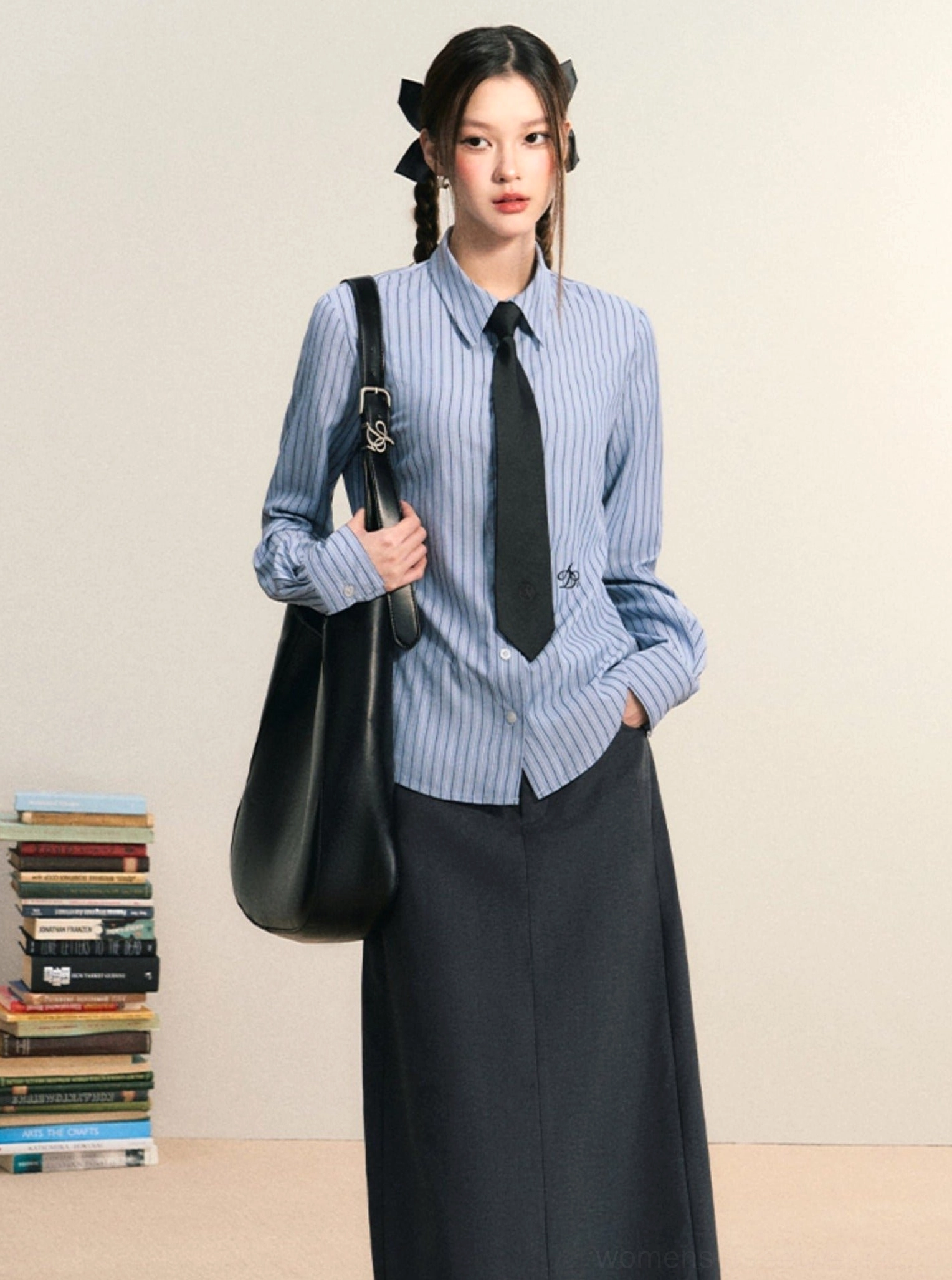 Blue and white striped women's Korean preppy button down shirt styled with a black tie and long dark skirt
