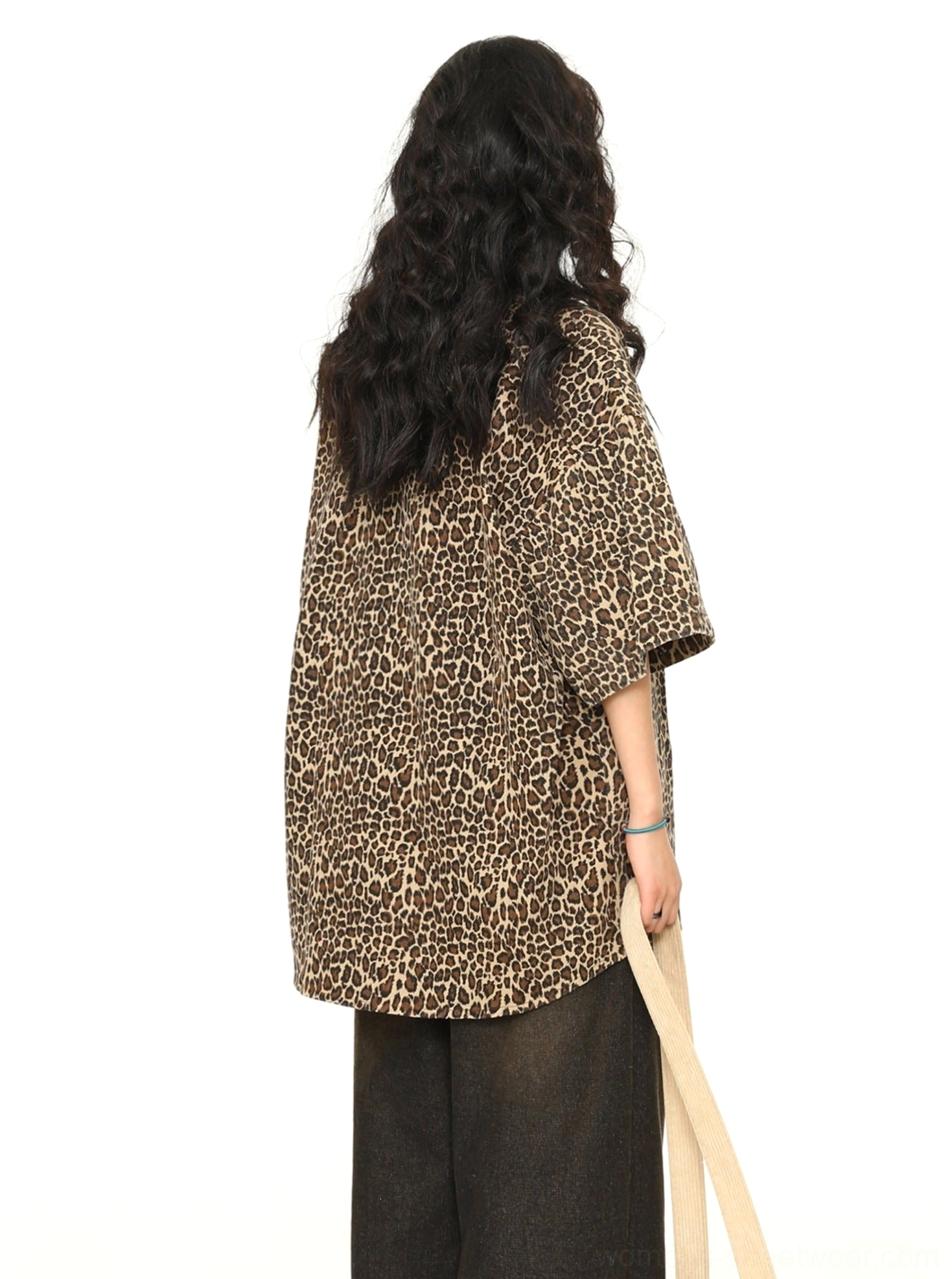 Full back view of women's oversized leopard print short-sleeve button-up shirt with relaxed streetwear silhouette