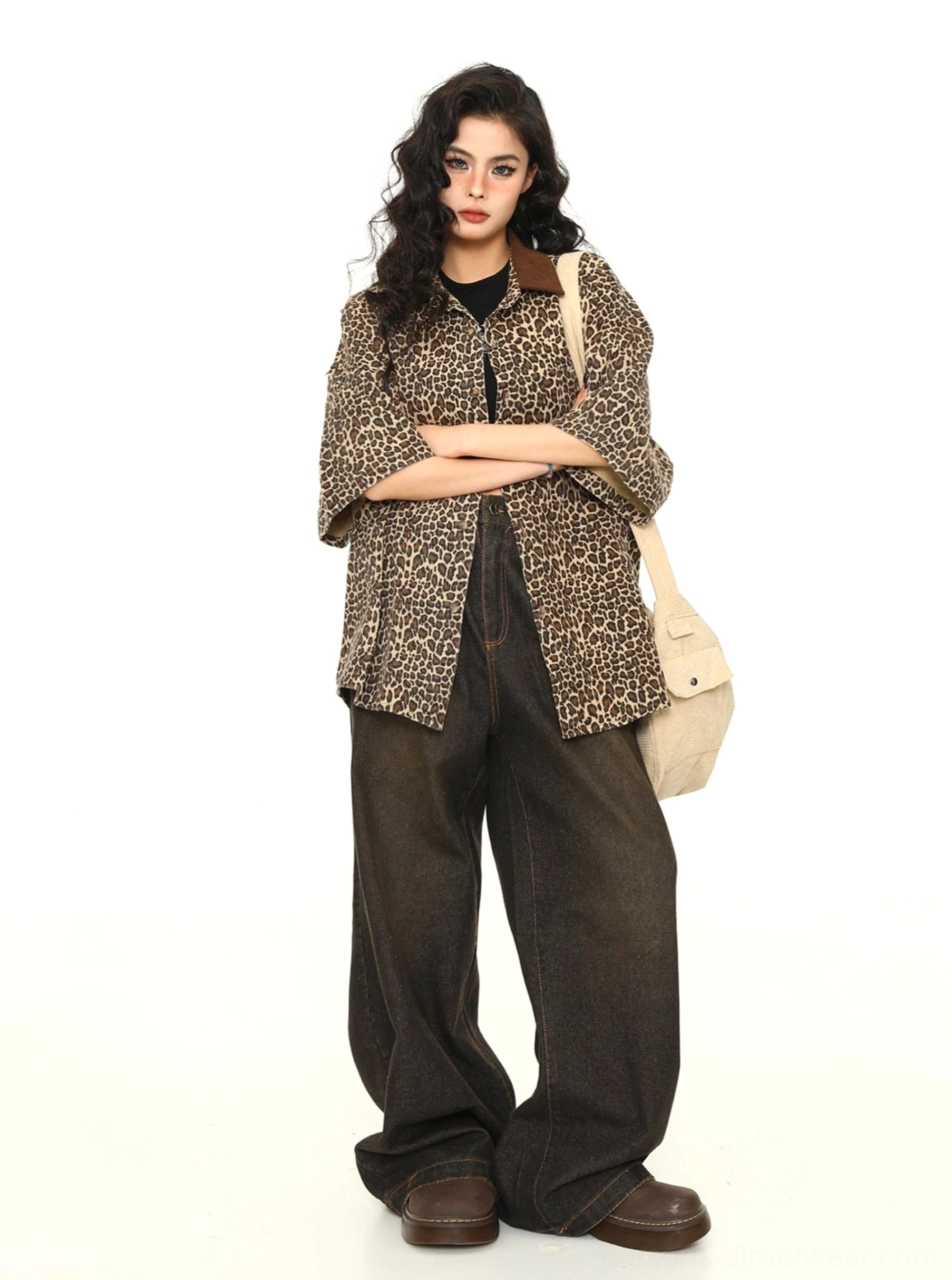 Women's leopard print oversized work shirt paired with dark wide-leg trousers and brown leather shoes for retro streetwear styling
