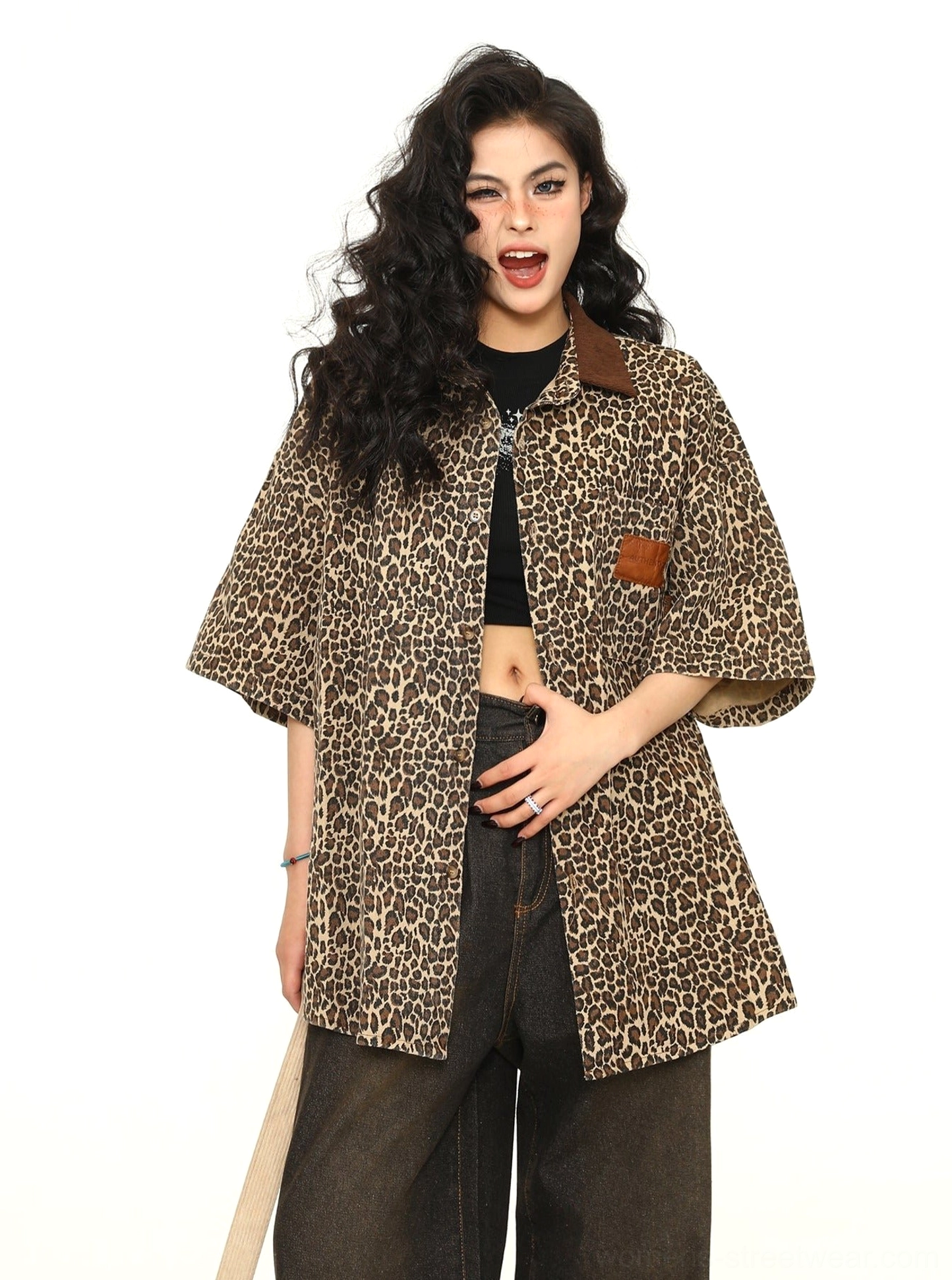 Angled front view of women's oversized leopard print button-up work shirt with brown contrast collar and relaxed short sleeves