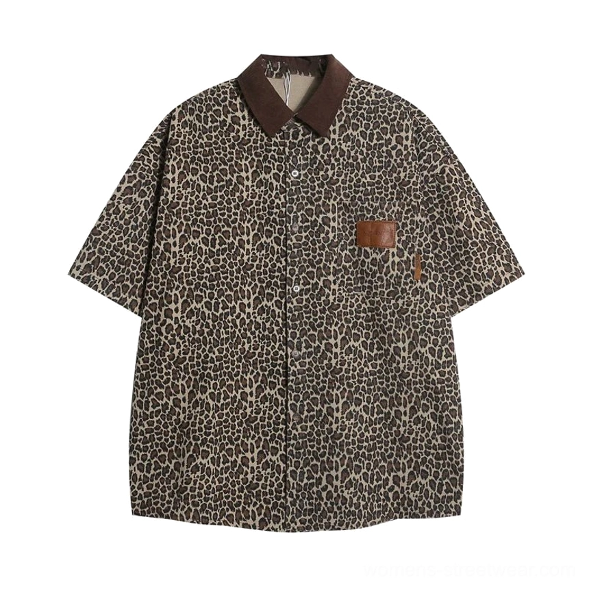 Flat lay of women's leopard print oversized short-sleeve workwear shirt with brown contrast collar button front and chest pocket patch