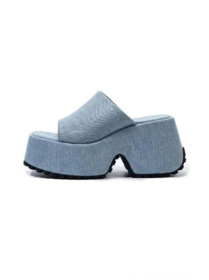 Light blue denim square toe platform slide sandal shown from the side with a wide upper and chunky black treaded outsole