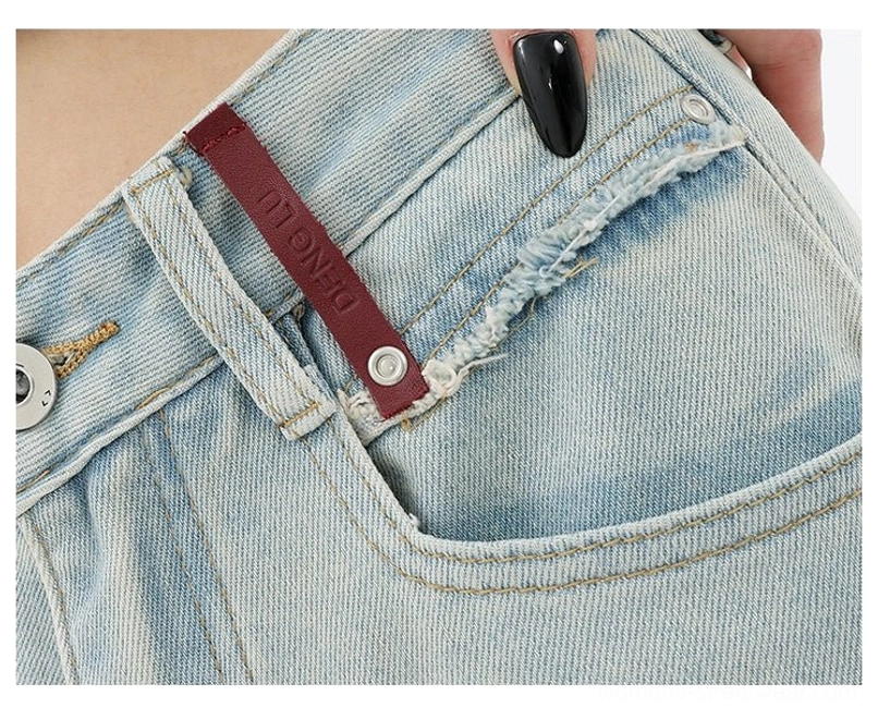 Women’s light blue wide-leg streetwear jeans with an easy relaxed fit and creative embroidered pocket accent