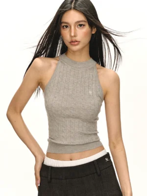Light grey fitted cropped cable knit mock neck tank top for women with subtle chest logo styled with low-rise trousers
