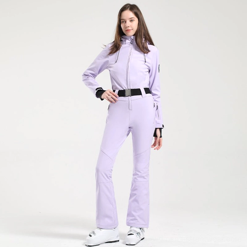 Women's light purple belted flared one-piece ski jumpsuit front view with black waist belt