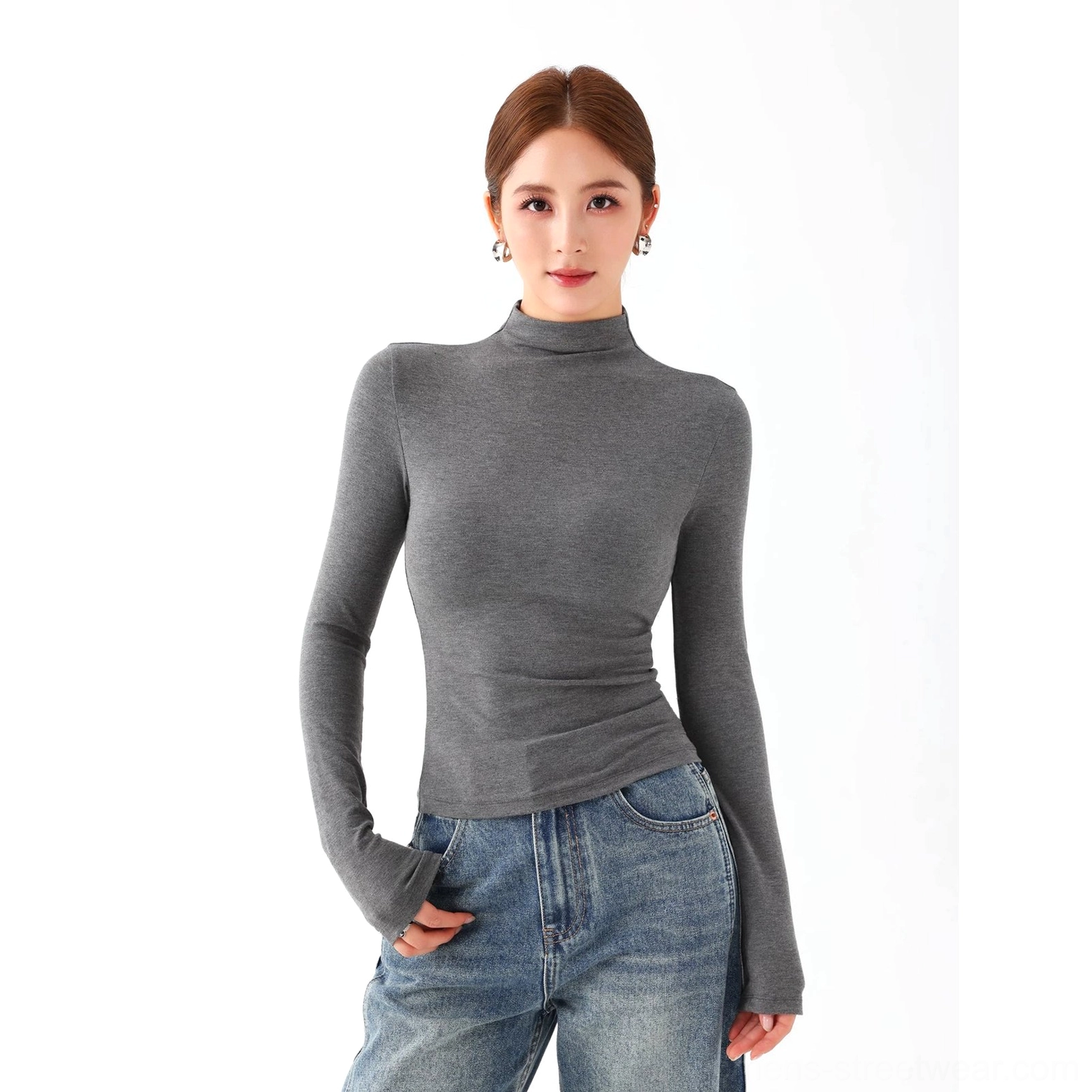 Women's long sleeve mock neck knit top with body contouring stretch and modern everyday styling