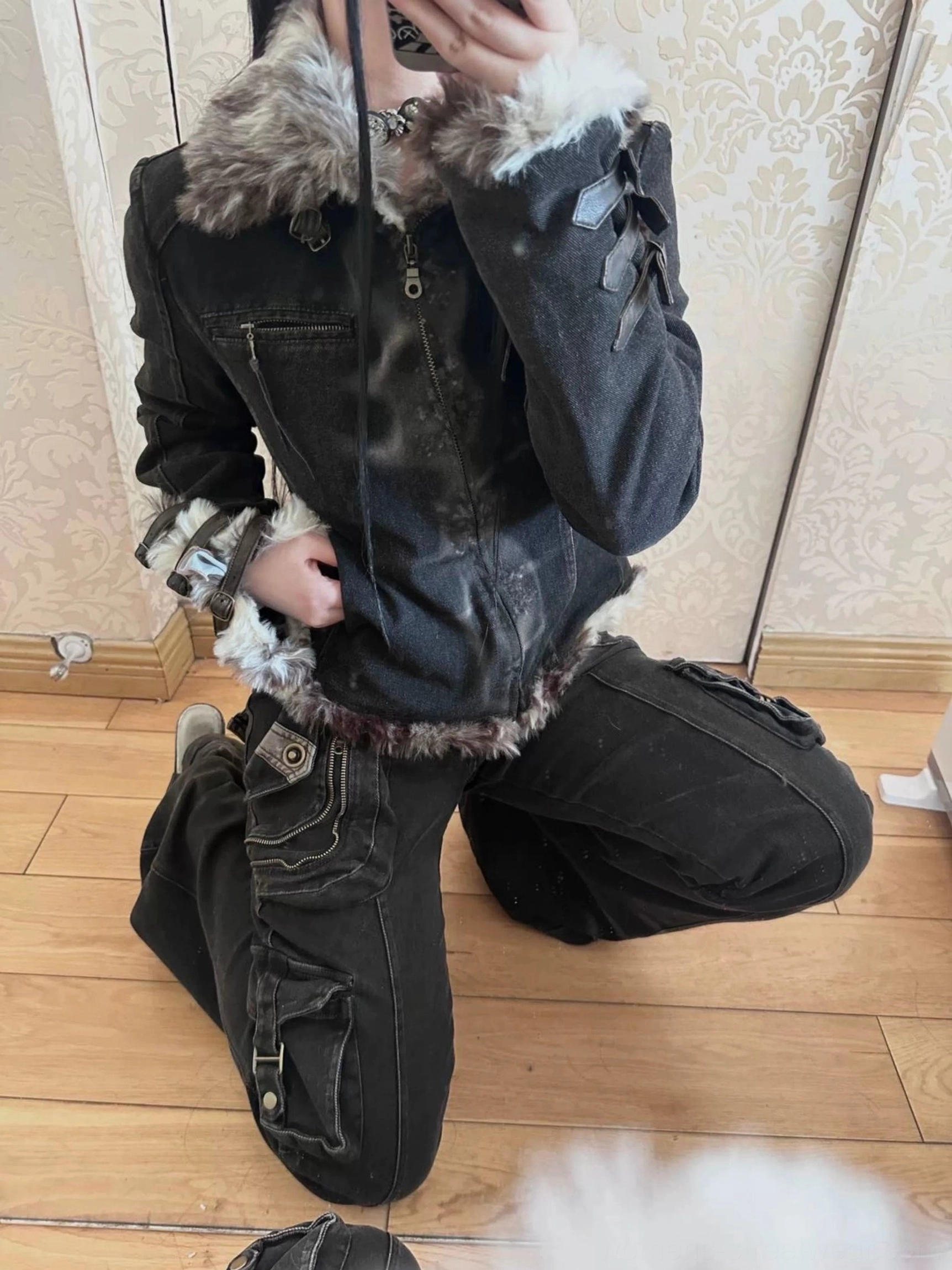 Women's low-rise washed black flare jeans with cargo pocket detailing, exposed hardware accents, and a bold Korean streetwear silhouette