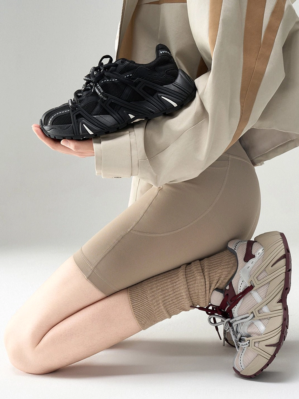 Women's mesh cage runner sneakers in silver burgundy and black colorways styled for retro techwear streetwear