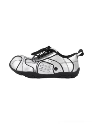 Women's metallic silver quilted foldover-tongue low-top streetwear sneaker shown from the left side with black laces, black trim, and rear pull tab